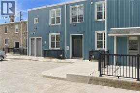 Cambridge apartment for rent - A blue building with a black fence in front.