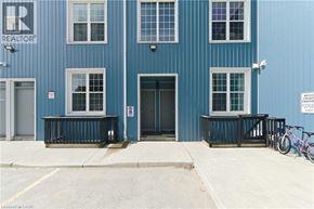 Cambridge apartment for rent - A blue building with a REALTOR sign on the top left corner.