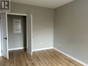 Oshawa (Central) condo for rent - A room with a doorway leading to another room.