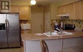 Markham (Wismer) apartment for rent - A kitchen with a refrigerator and a sink.