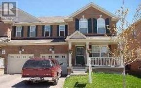 Markham (Wismer) apartment for rent - A house with a red car parked in front.