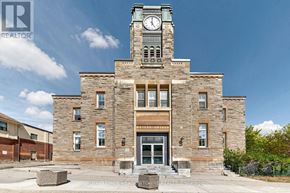Halton Hills (Georgetown) multi-family for rent - A large stone building with a clock tower in the middle of it.