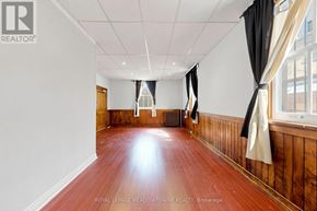 Halton Hills (Georgetown) multi-family for rent - A room with wooden floors and white walls.