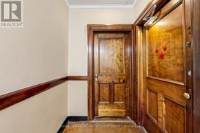 Halton Hills (Georgetown) apartment for rent - A wooden door with a handle and a doorknob.