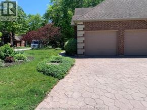 Lasalle apartment for rent - A house with a driveway and garage in front of it.