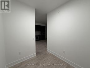 Toronto (Dovercourt-Wallace Emerson-Junction) condo for rent - A white hallway with a logo on the wall.