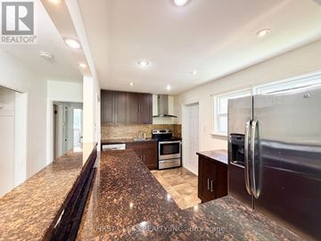 Toronto (Dorset Park) apartment for rent - A kitchen with granite countertops and stainless steel appliances.