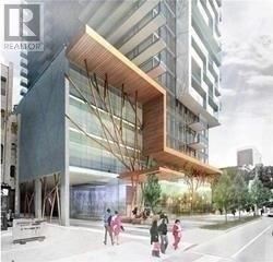 Toronto (Church-Yonge Corridor) condo for rent - A modern building with a wooden overhang and people walking in front.