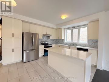 Markham (Cedarwood) apartment for rent - A kitchen with white cabinets and a stainless steel refrigerator.