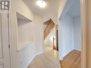 Markham (Cornell) apartment for rent - A hallway with a staircase and a light on the wall.