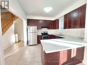 Markham (Cornell) apartment for rent - A kitchen with brown cabinets and a white countertop.