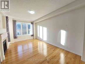 Markham (Cornell) apartment for rent - A spacious room with wooden flooring and a fireplace on the left side.