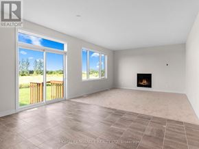 Ottawa apartment for rent - A spacious room with a fireplace and large windows.