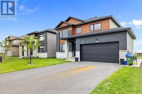Ottawa apartment for rent - A modern two-story house with a garage is for sale.