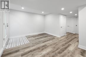 Ottawa apartment for rent - A room with wooden flooring and white walls.