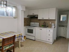 Toronto (Tam O'shanter-Sullivan) apartment for rent - A kitchen with a table and chairs in front of it.