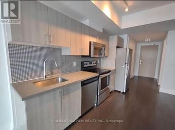 Toronto (Yorkdale-Glen Park) condo for rent - A kitchen with a sink, stove, and refrigerator.
