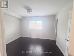 Oakville (Ro River Oaks) townhouse for rent - A room with a window and a door is for sale.