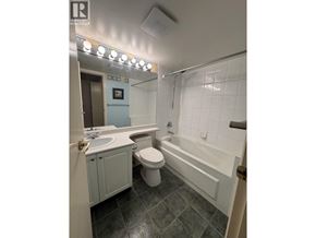Richmond apartment for rent - A bathroom with a toilet, sink, and bathtub.