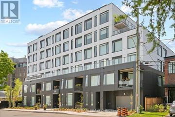Ottawa apartment for rent - A modern multi-story building with balconies and a glass facade.