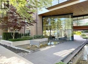 Vancouver apartment for rent - A modern building with a water feature in front.