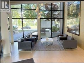 Vancouver apartment for rent - A realtor office waiting area with a large window.