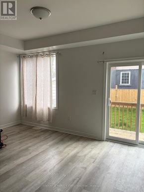 Hamilton (Hamilton Beach) apartment for rent - A room with a sliding glass door leading to a backyard.