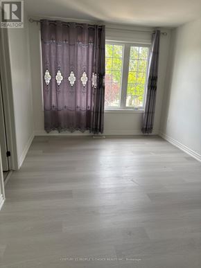 Hamilton (Hamilton Beach) apartment for rent - A room with a window and curtains.