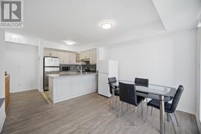 Toronto (Humbermede) townhouse for rent - A modern kitchen with a dining table and chairs.