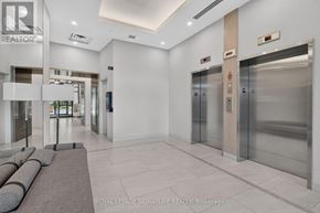 Oakville (Go Glenorchy) condo for rent - A hallway with a sign that says "REALTOR" on the wall.
