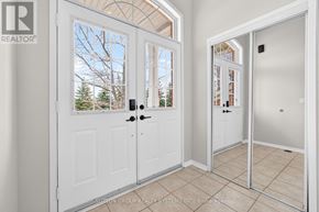 Mississauga (Meadowvale Village) townhouse for rent - A white door with a glass window is open to a hallway.