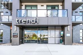 Hamilton (Waterdown) condo for rent - The entrance to a building with the word "trend" on it.