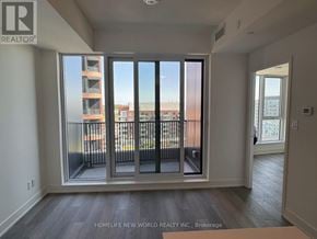 Markham (Unionville) condo for rent - A room with a large window overlooking a balcony with a view of a building.