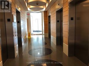 Toronto (Bendale) condo for rent - A hallway with elevators and a sign that says "EXIT".