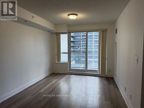 Richmond Hill (Doncrest) condo for rent - A room with a window and wooden flooring.