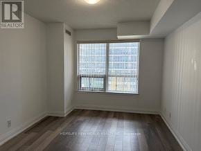 Richmond Hill (Doncrest) condo for rent - A room with a window and wooden flooring.