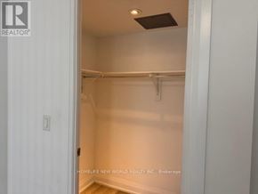 Richmond Hill (Doncrest) condo for rent - A white doorway leads to a small, empty room with a light fixture on the ceiling.