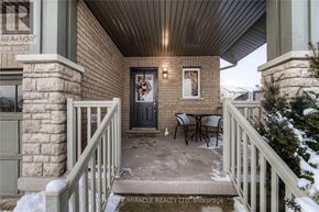Guelph (Pineridge/Westminster Woods) apartment for rent - A snowy porch with a table and chairs.