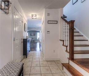 Guelph (Pineridge/Westminster Woods) apartment for rent - A hallway with a staircase and a sign that says "Look Up".