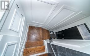 Toronto (Mount Pleasant West) townhouse for rent - A staircase with wooden steps and white walls.