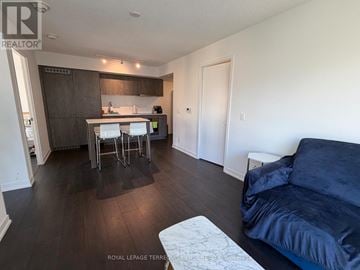 Toronto (Church-Yonge Corridor) condo for rent - A living room with a couch and a dining table.
