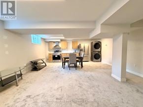Niagara Falls (Lyons Creek) apartment for rent - A spacious living room with a dining area and a kitchenette.