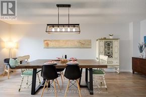 Stratford apartment for rent - A dining room with a wooden table and chairs.