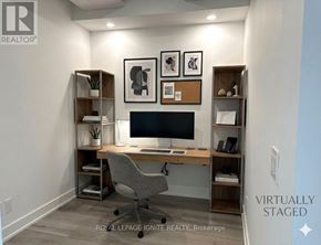 Toronto (Clairlea-Birchmount) condo for rent - A room with a desk, chair, and shelves with various items on them.