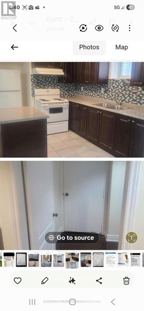 Brampton (Bram East) apartment for rent - A kitchen with dark brown cabinets and a white stove top oven.