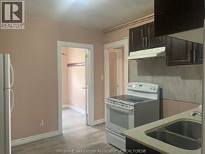 Windsor apartment for rent - A kitchen with a refrigerator, stove, and sink.