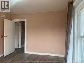 Windsor apartment for rent - A room with a doorway leading to another room.