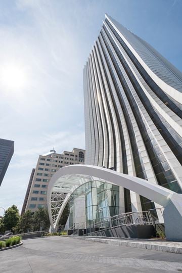 Rochester apartment for rent - A modern building with a curved glass entrance.