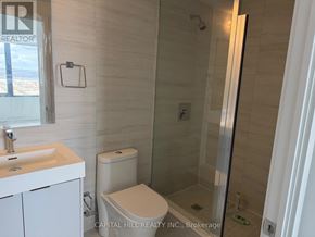 Vaughan (Vaughan Corporate Centre) condo for rent - A white sink and toilet in a small bathroom.