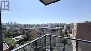 Toronto (Forest Hill North) condo for rent - A cityscape viewed from a balcony with apartment buildings.